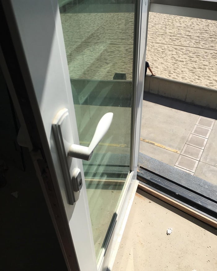 Custom access change: Building corridor door converted from a two-sided handle to inside-only access.