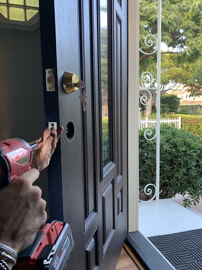 Double-cylinder deadbolt: Boring the door for the new deadbolt, the door and trim stay untouched.