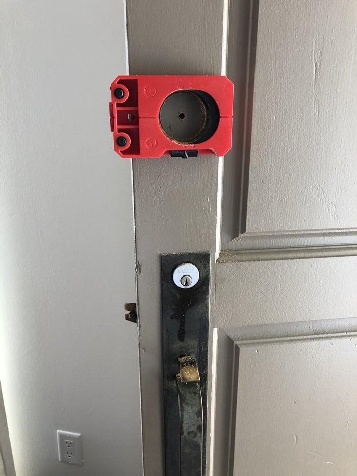 Igloohome keypad: Alignment jig on the door to bore for the new keypad.