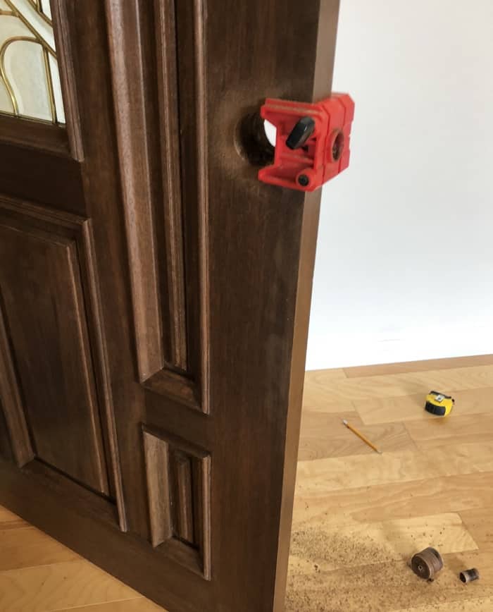 Handleset installation: New handleset and deadbolt on a walnut entry door. Coral Gables.