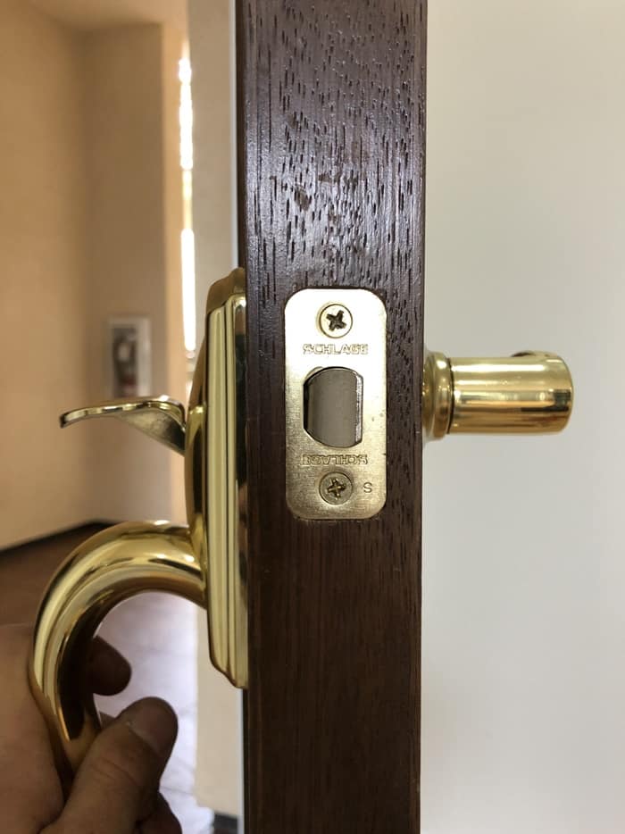 Handleset installation: Latch and lever fitted, ready for the strike plate.